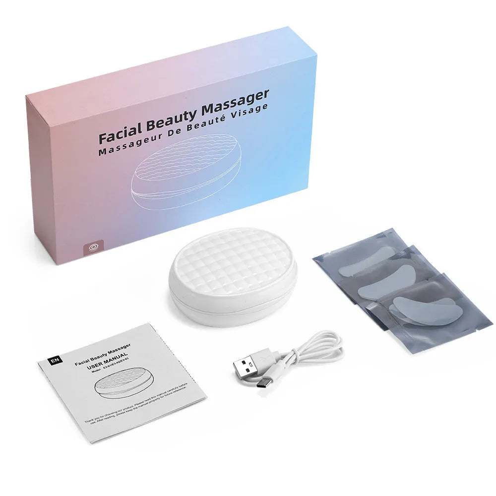 White wireless red light EMS eye and face two-in-one massage device on a white background.