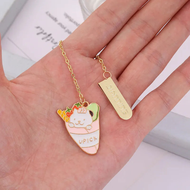 Jane Lime Foodie Cat metal bookmark with cartoon pendant in four colour variations on a white background.