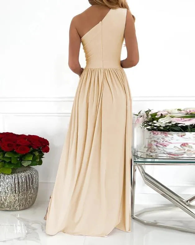 Apricot one shoulder maxi dress with high split and cutout detail on a mannequin