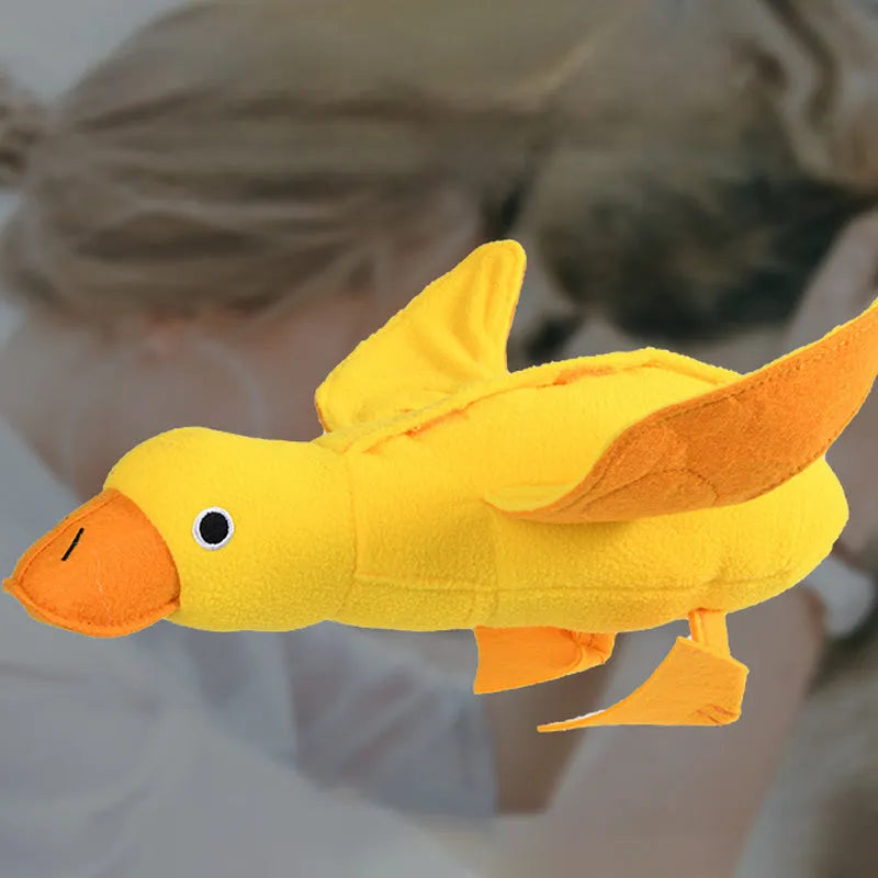 Yellow duck plush dog toy with a barking sound module for treat-dispensing play