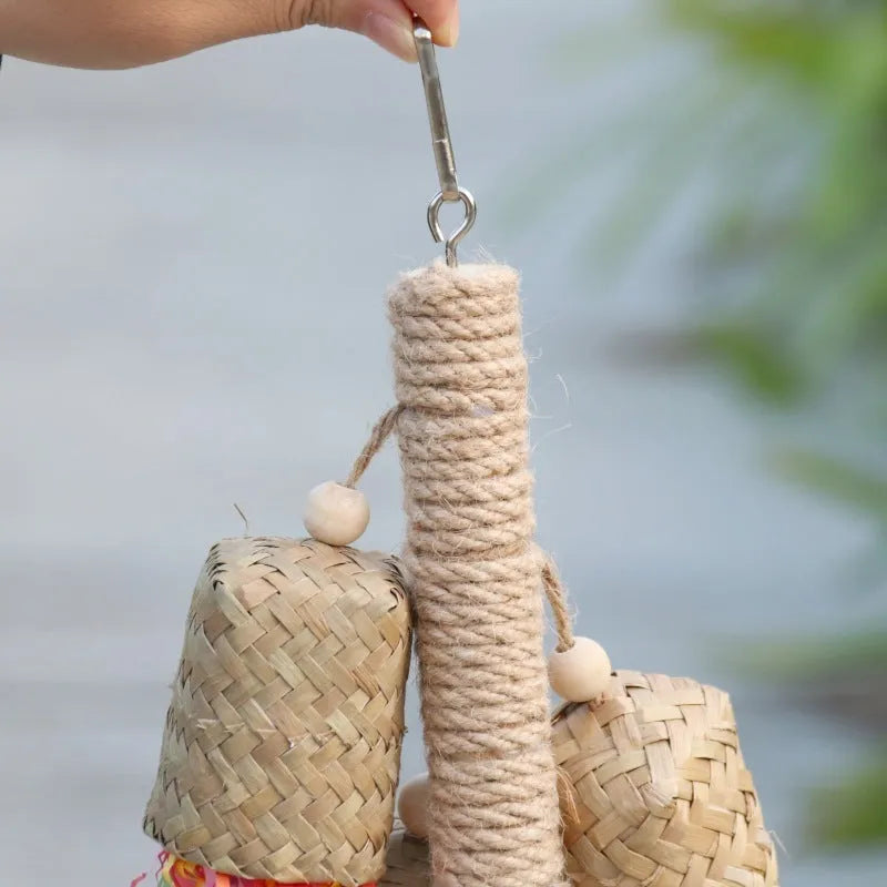 Colourful shredded paper hanging bird toy made of wood and sisal for parrots.