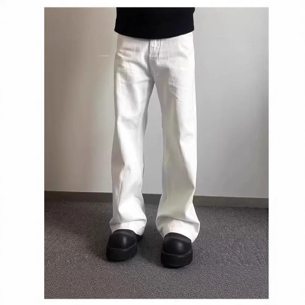 Men's straight-cut white wide-leg denim jeans with a mid waist and zipper fly
