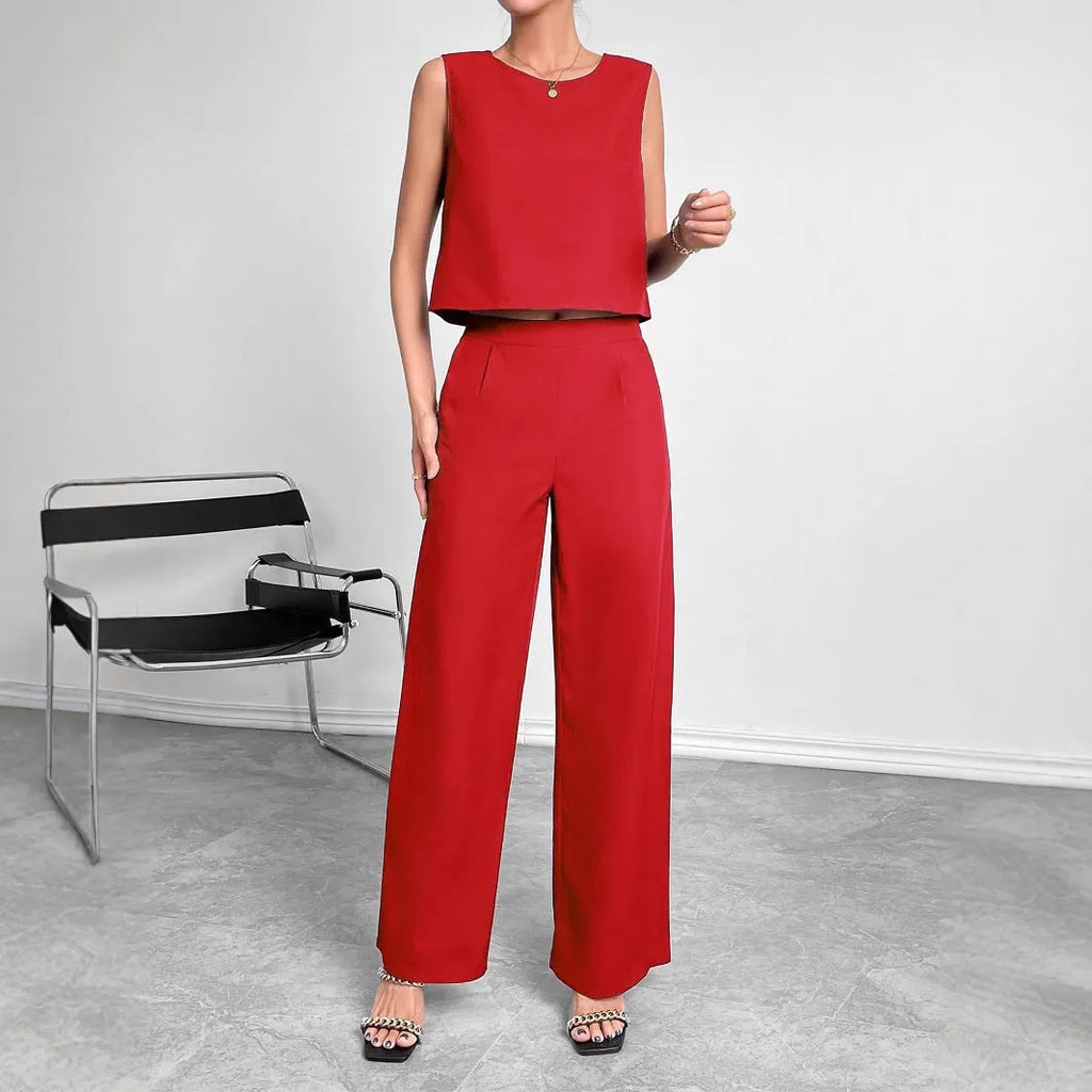 Red women's two-piece set with sleeveless top and wide leg trousers