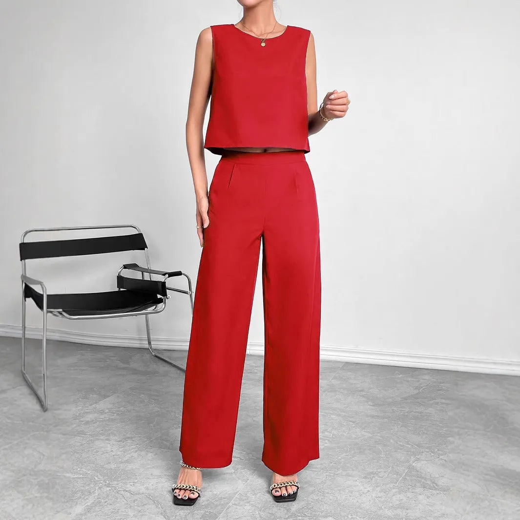Red women's two-piece set with sleeveless top and wide leg trousers