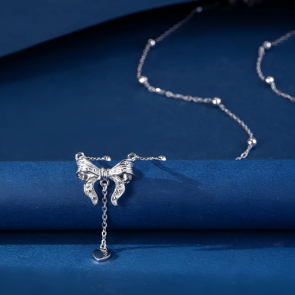 S925 sterling silver adjustable clavicle chain with a heart and butterfly pendant.