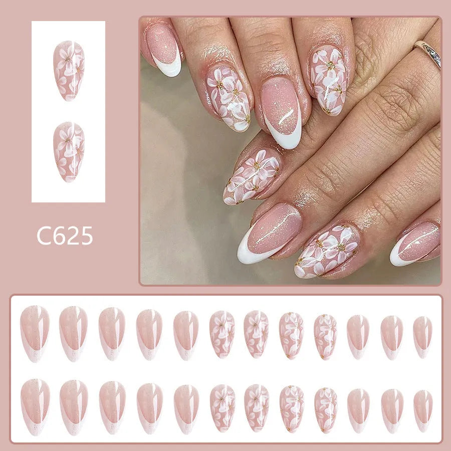 Removable short almond nails with French style finish and glitter flower decoration in colour C625