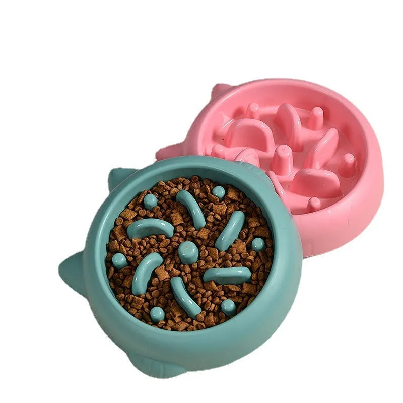 Green bone-shaped slow feeder bowl for dogs with raised maze pattern inside