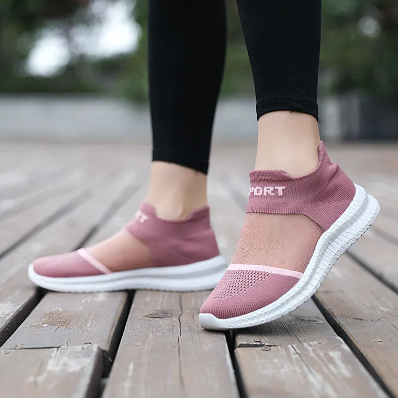 Casual beige Flyknit sports socks shoes with lace-up front and round toe on a neutral background.
