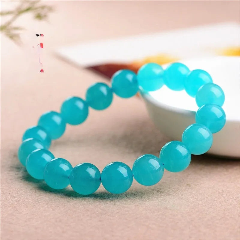 Grade 7A Amazonite natural scattered beads in ice colour showing polished surface and size variations