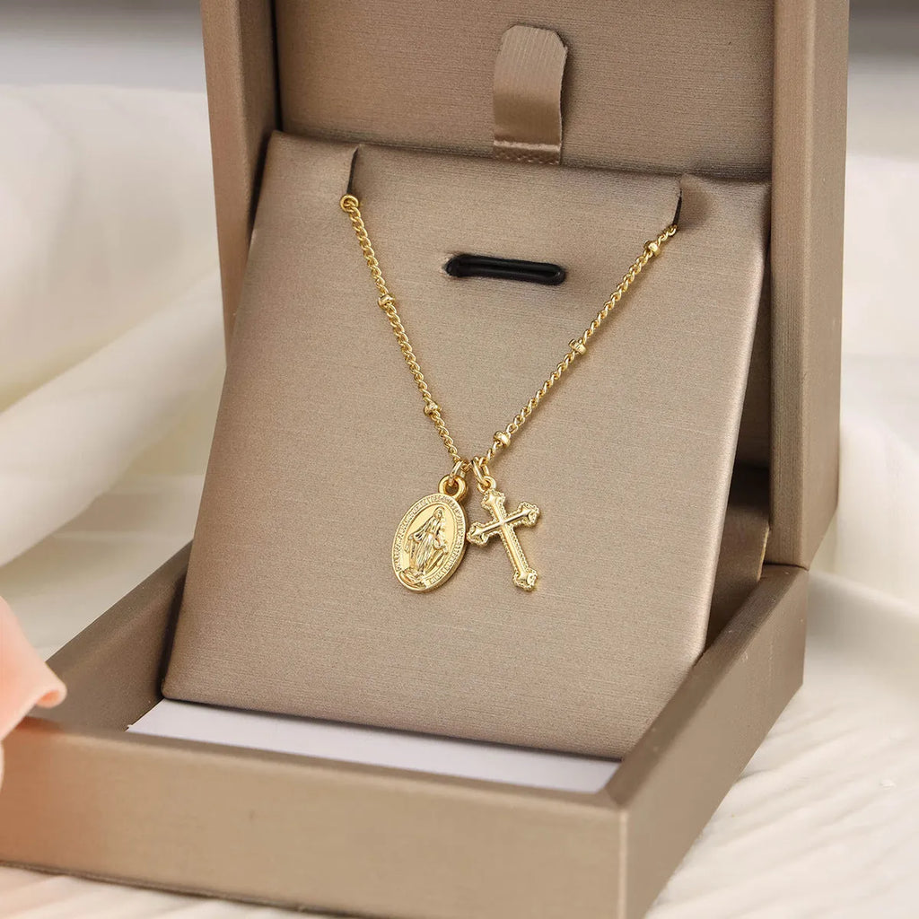 Virgin Mary geometric cross necklace in gold colour with simple styling
