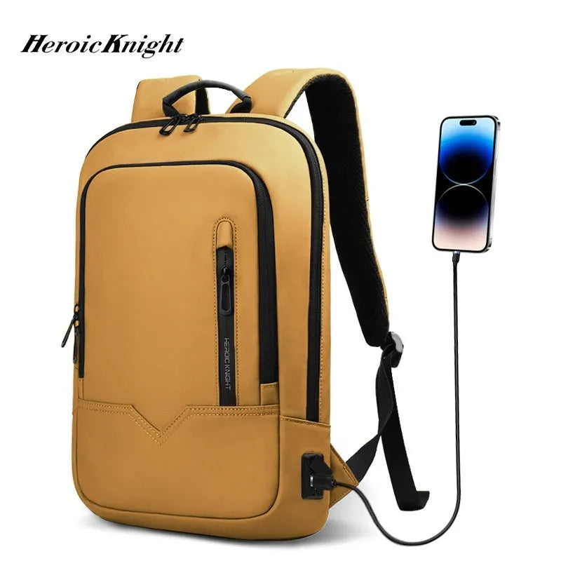 Lightweight grey polyester computer backpack with USB charging port on the shoulder strap