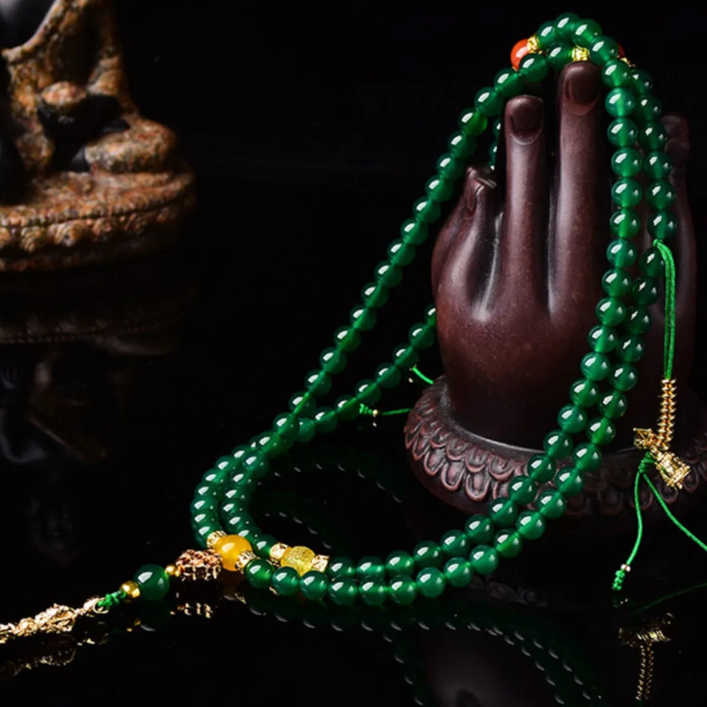 Multi-strand green agate bracelet for men and women on wrist, showing natural stone beads.
