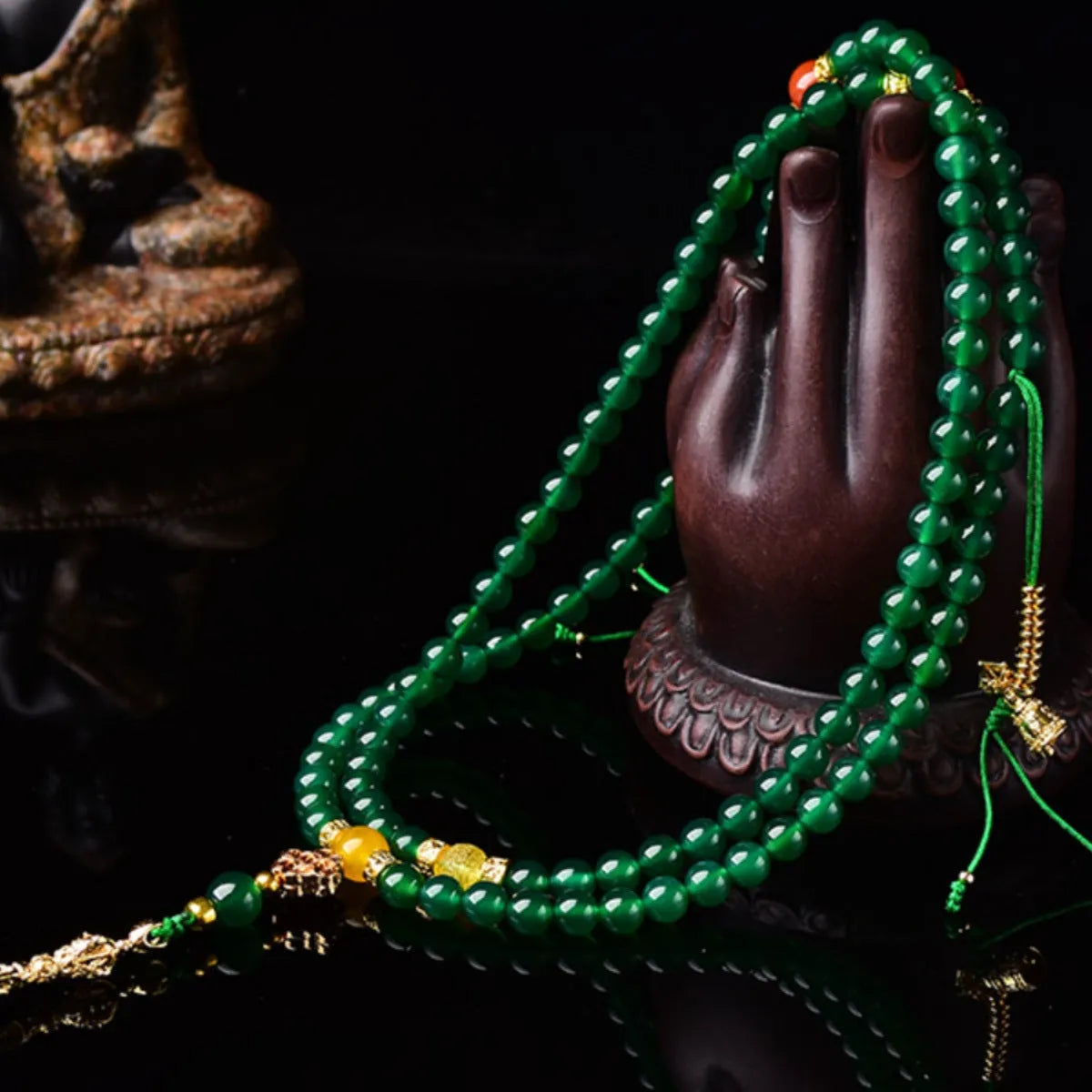 Multi-strand green agate bracelet for men and women on wrist, showing natural stone beads.