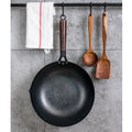Traditional black iron wok pan with wooden handle measuring 32cm diameter