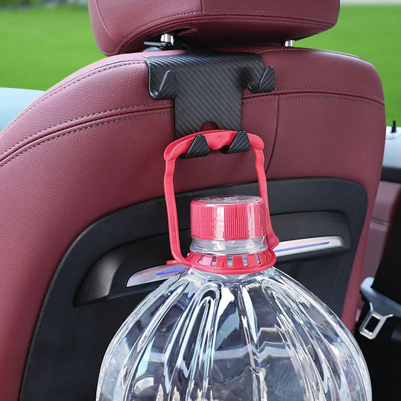 Black ABS plastic car multifunction hook and mobile phone holder bracket for rear seat storage.