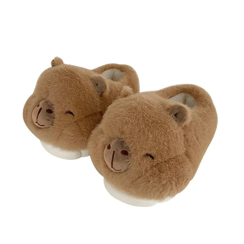 Light brown women's winter slippers with a cartoon pattern, plush upper, and round toe.
