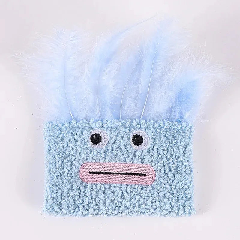 A funny big mouth explosion head shaped catnip plush toy shown in blue, green, orange, and purple colours.