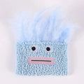 A funny big mouth explosion head shaped catnip plush toy shown in blue, green, orange, and purple colours.