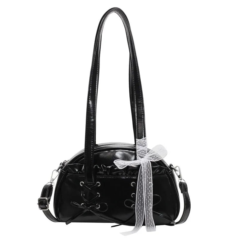 Women's casual shoulder handbag with bandage bow detail in PU material showing internal phone compartment