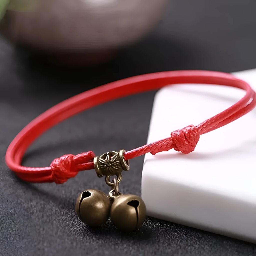 Small adjustable nylon dog collar with brass bell in black, red, or coffee colours