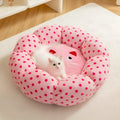 Pink cat bed cushion with dot pattern showing two size options for cats up to 20 pounds