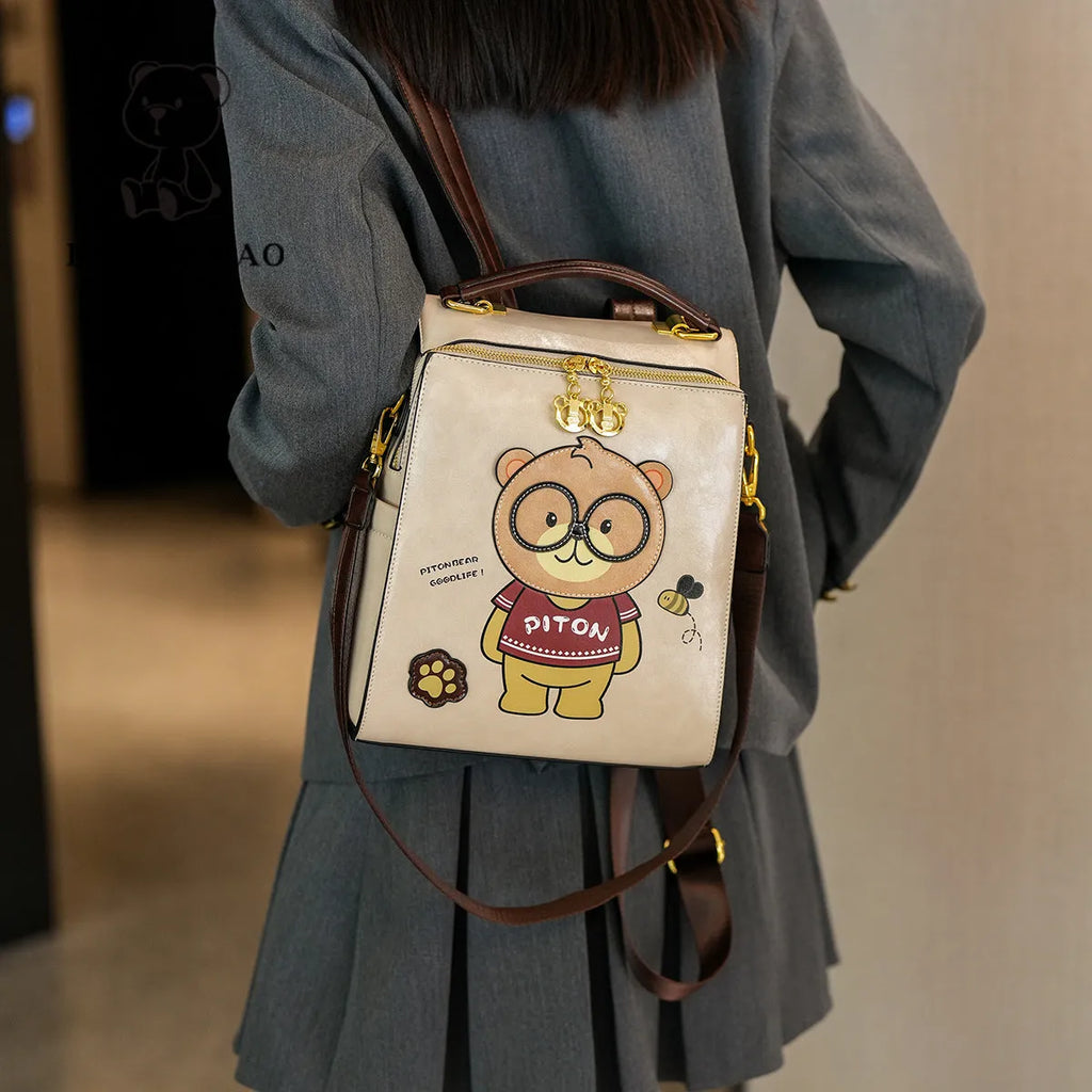 Cartoon bear female large capacity retro sling backpack in creamy-white with sewing line detail