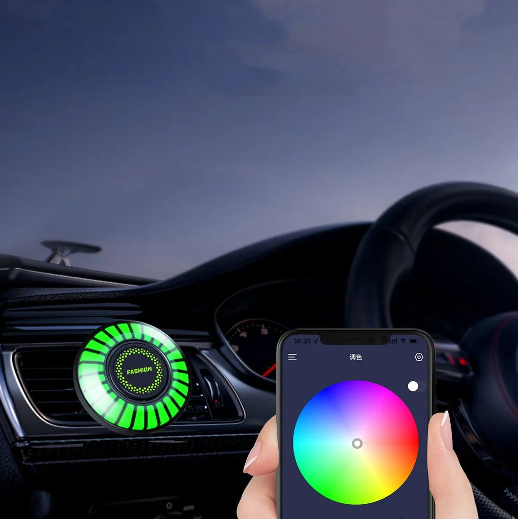 3D RGB car atmosphere light mounted on a car air vent, showing voice control and aromatherapy functions.