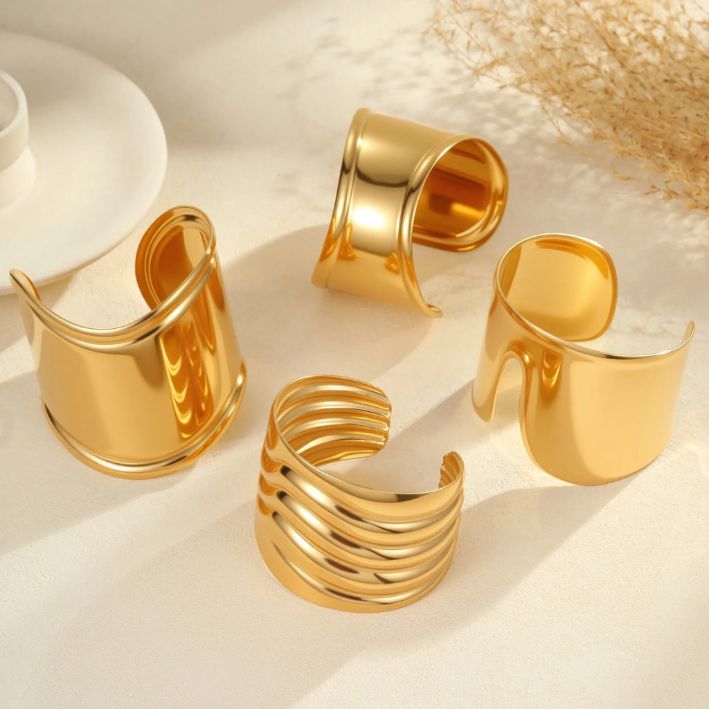 Women's wide fashion bracelet with gold plating and geometric wave design