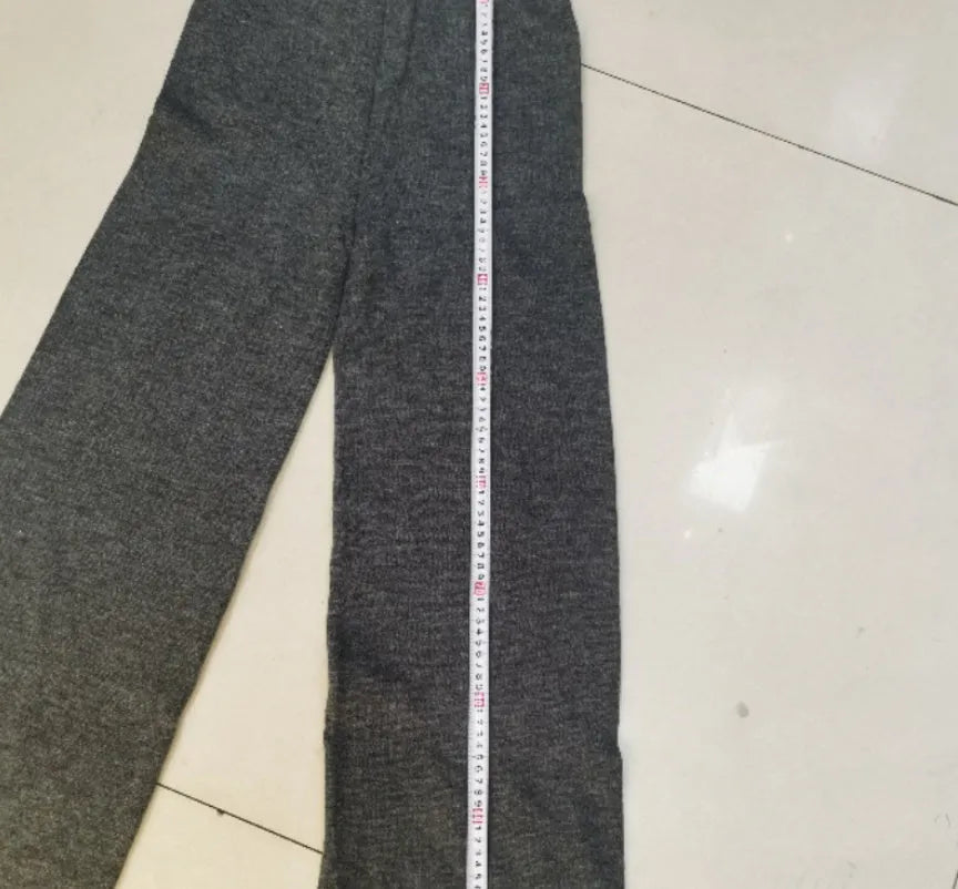 Women's side-slit sweater suit set with matching trousers in solid pattern design