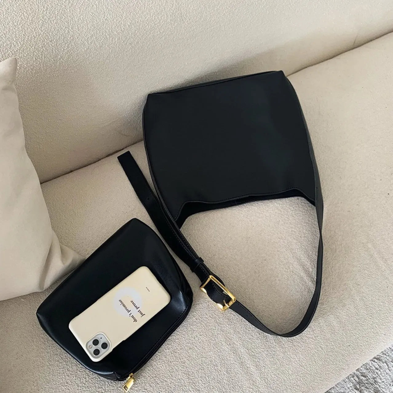 Women's soft PU leather shoulder bag with swing threads design in black or brown, showing 28x32x12cm dimensions