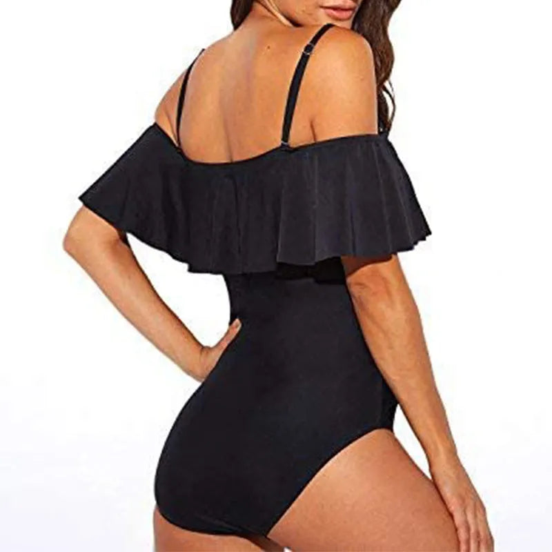 Black one-piece swimsuit with cut-out detailing and ruffled strap tube top design