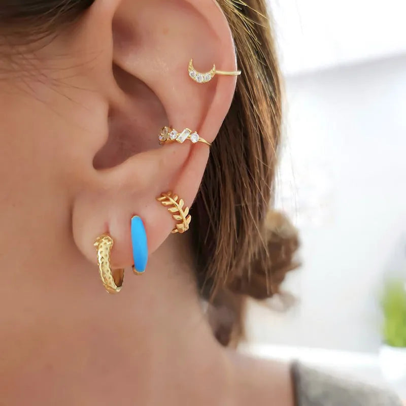 Geometric U-shaped oval curved stud earrings with a marbled dripping oil colour finish.