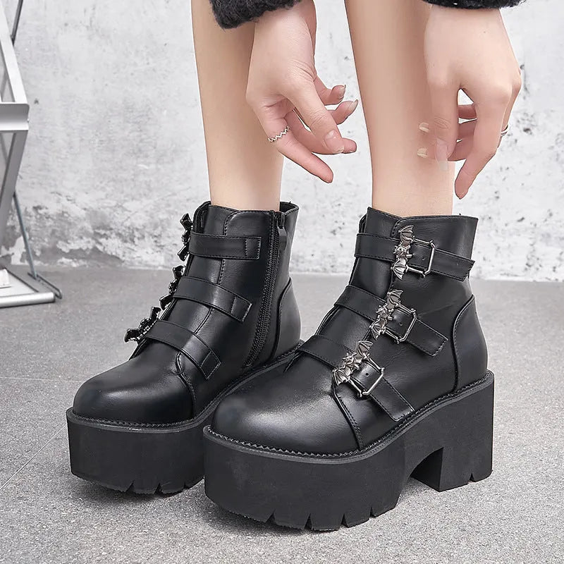 Black women's punk ankle boots with bat buckle and side zip, thick platform heel
