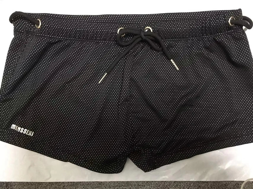 Men's low waist boxer swimming trunks in nylon lace fabric available in multiple solid colours