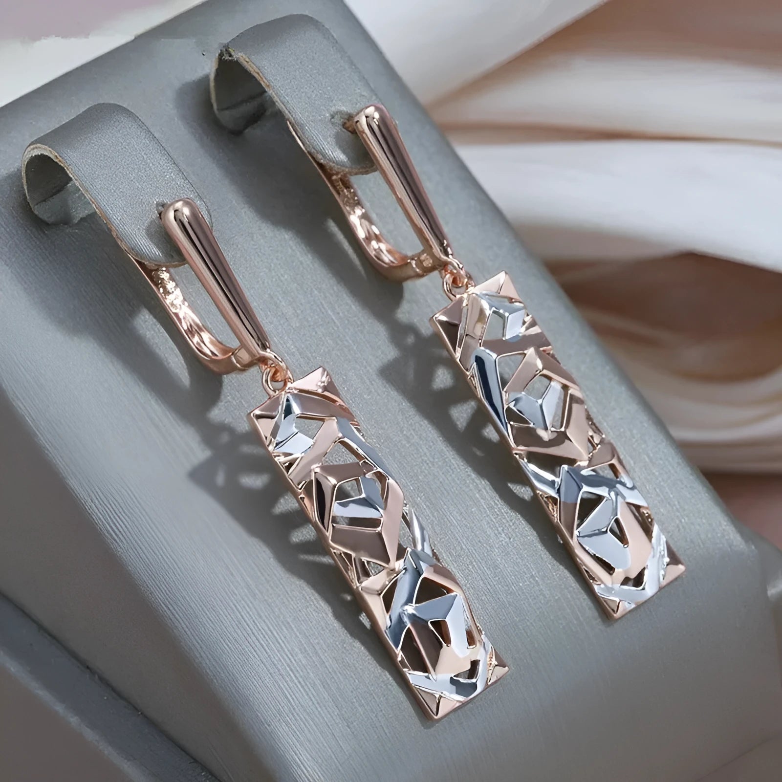 Rectangular hollow two-tone stud earrings with geometric pattern