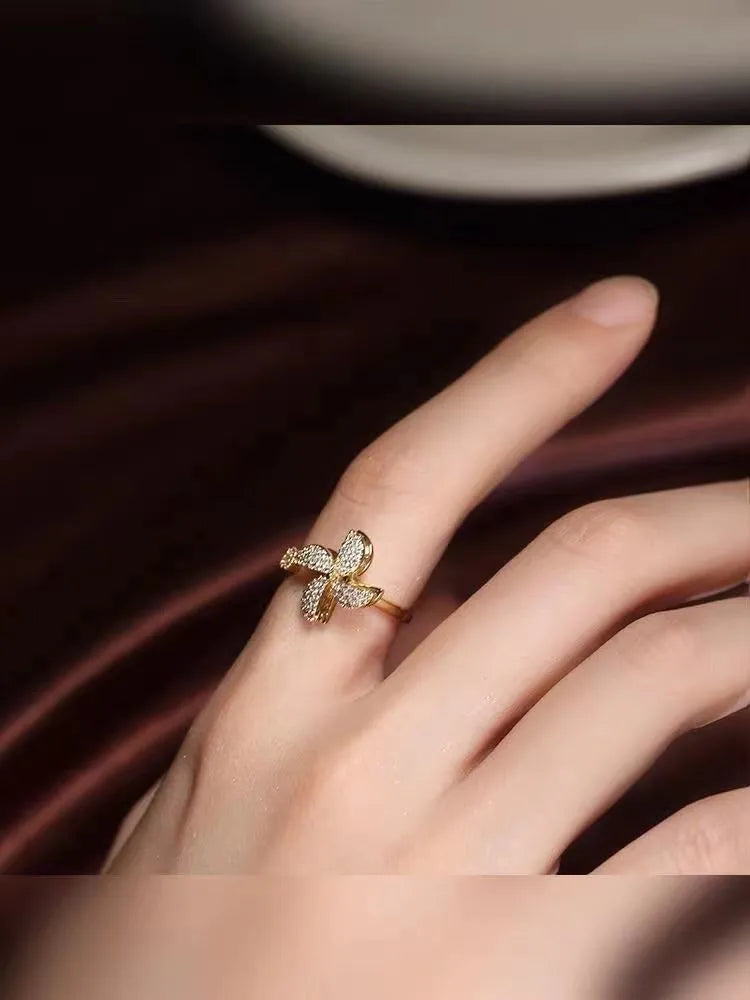 Rotating geometric ring with spinning windmill design in gold or silver electroplated finish