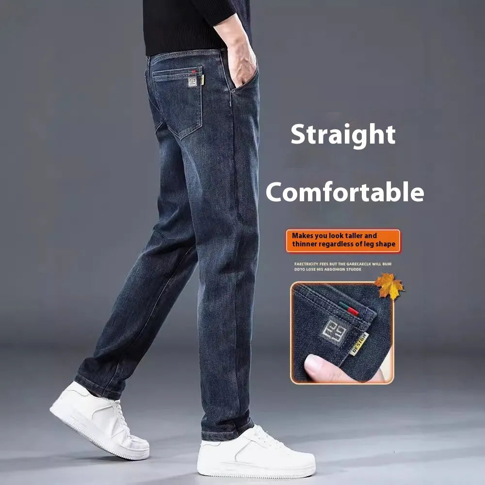 Men's slim straight casual trousers in blue-grey, showing a loose fit and zip fly detail.