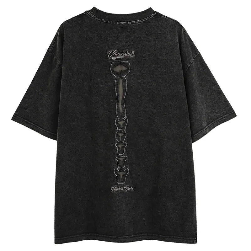 Black skull graphic short sleeve cotton T-shirt with drop shoulders on a hanger.