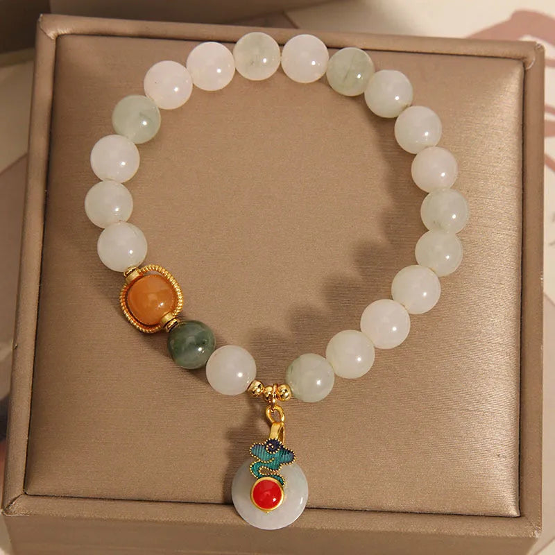 Women's ice jade bracelet with pearl accents and xiangyun peace jade buckle in retro design