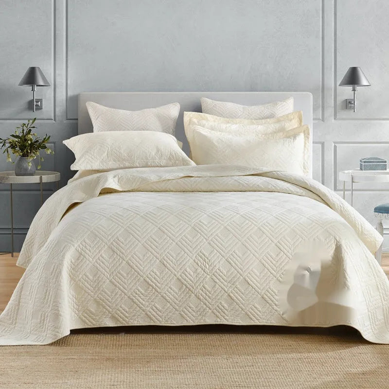 Pure cotton double-sided bed cover set with damask pattern and matching pillowcases on bed