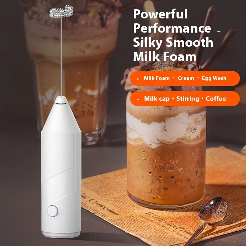 A handheld electric milk frother with a stainless steel wand and a plastic body, shown in black, white, and khaki colour options.