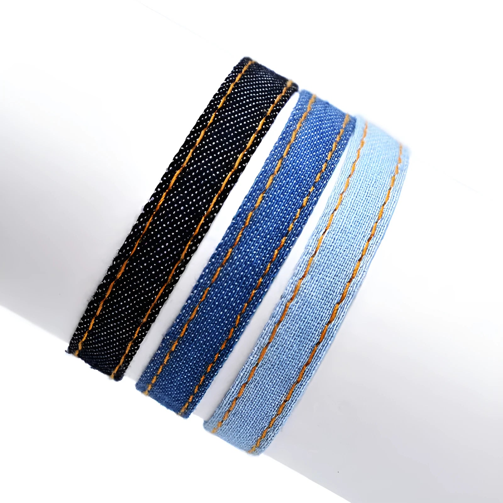 Denim fabric bracelet carrying strap with mixed material construction in unisex design