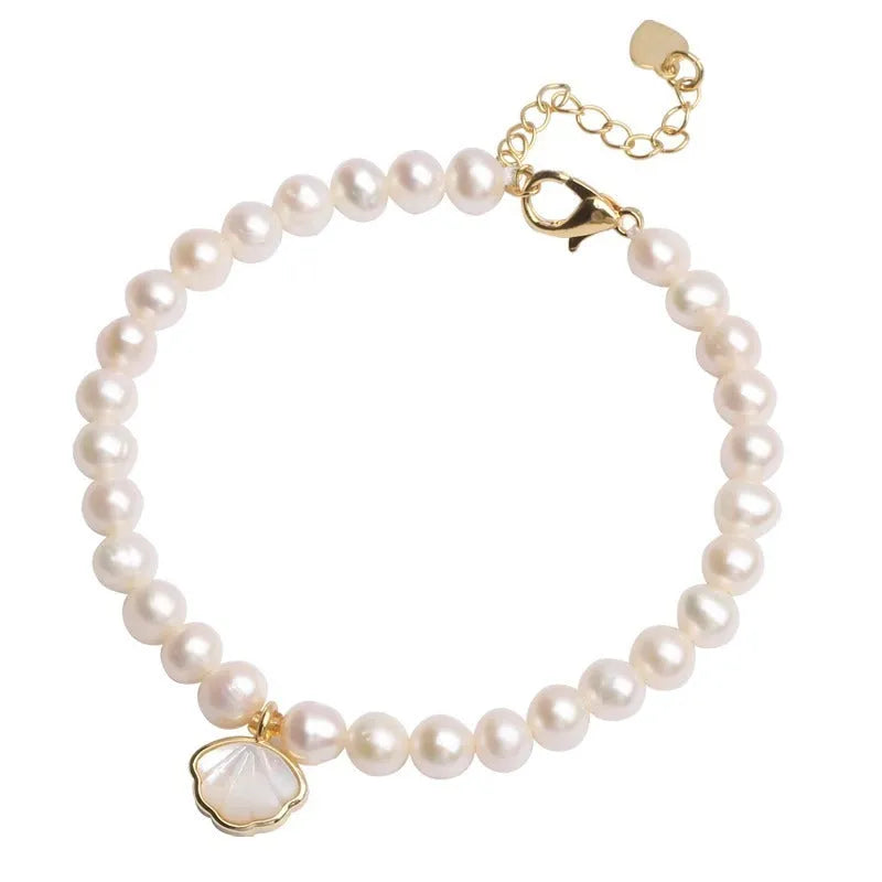 Women's freshwater pearl fan bracelet with 5-6mm pearls on elastic or chain fitting
