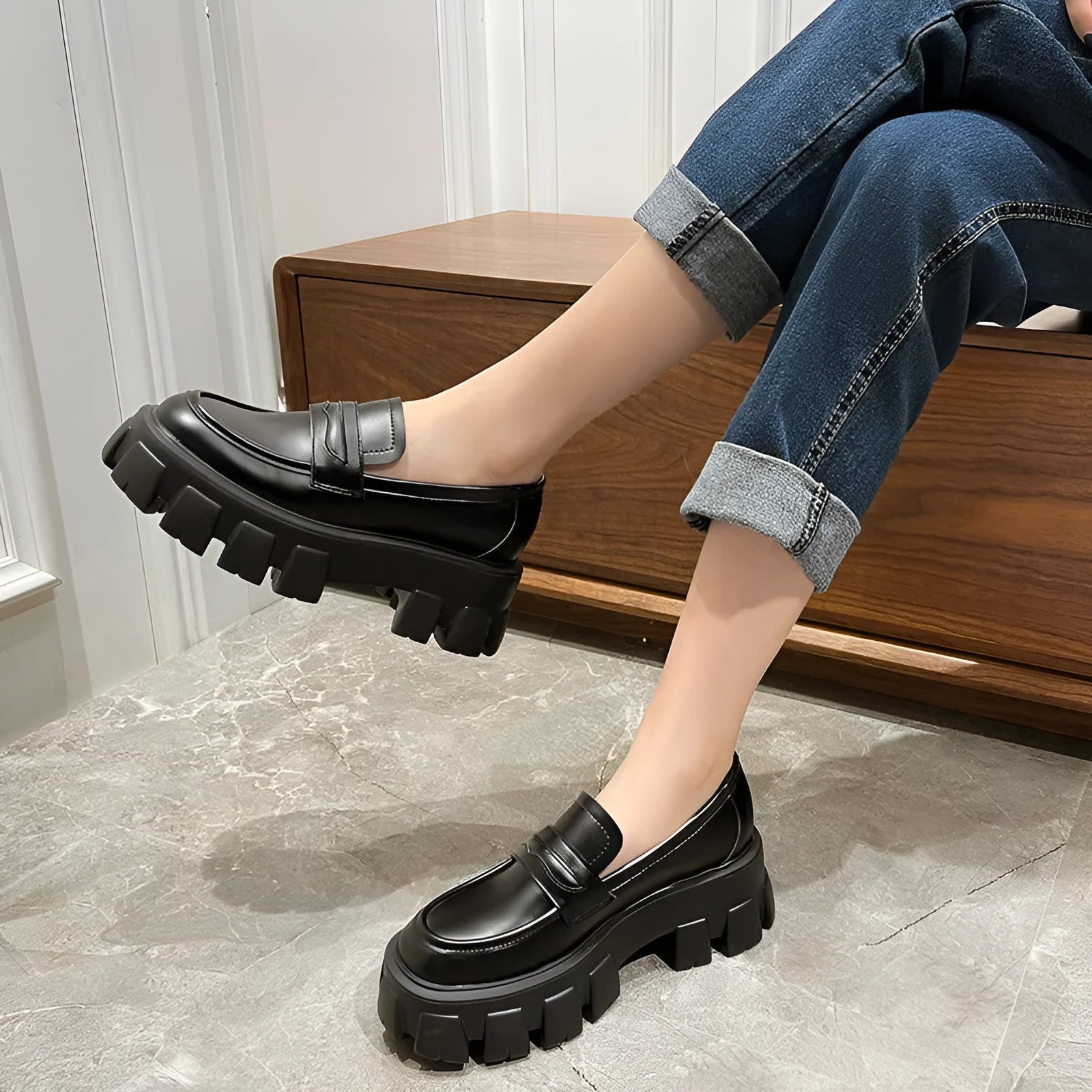 Men's wide fit British style loafers in patent leather with a rubber sole and muffin heel.