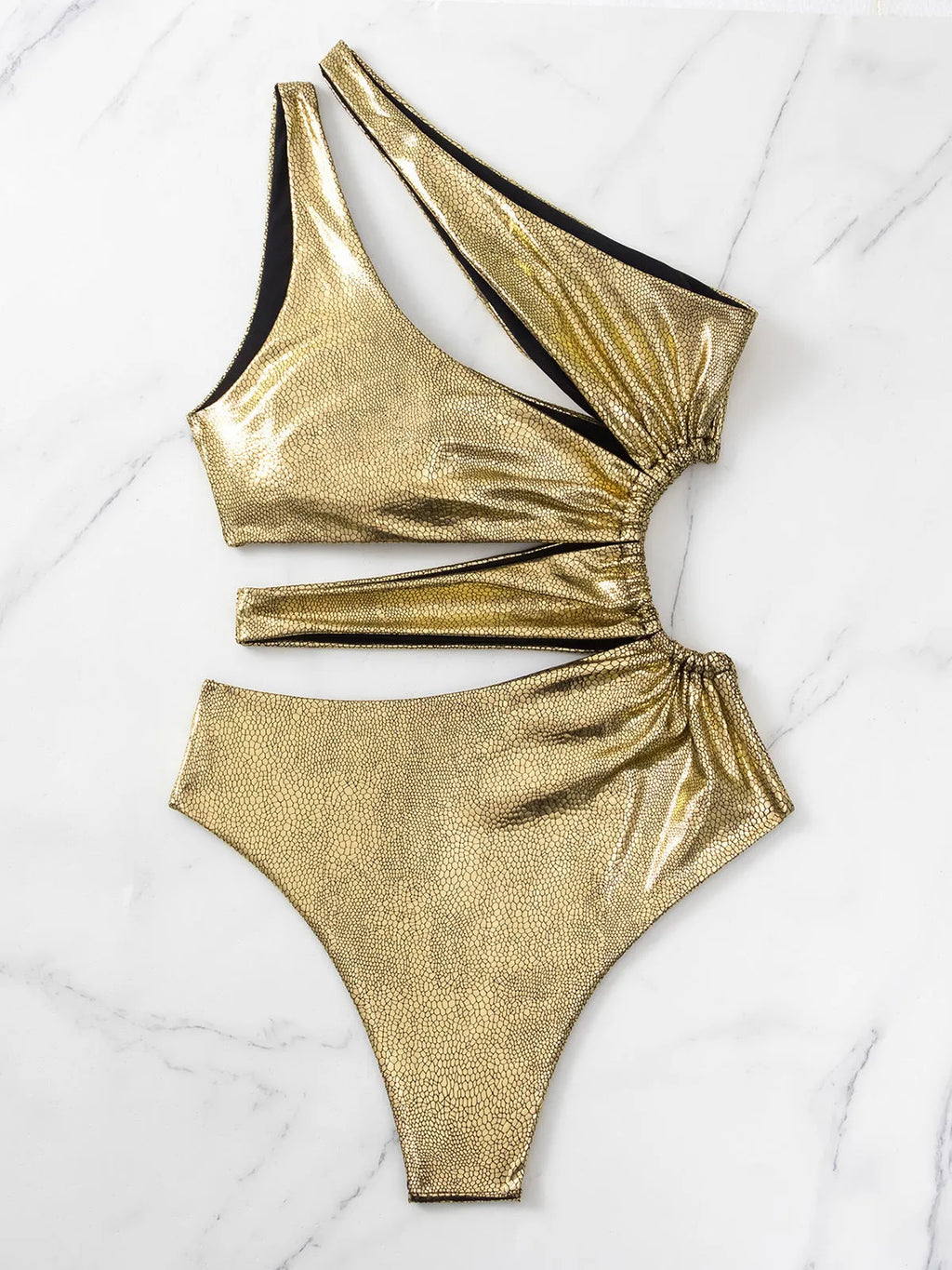 Women's one-piece swimsuit in gold with a backless design.