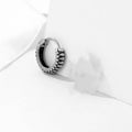 Geometric silver retro twist earrings with stripe detailing on circular titanium steel hoop