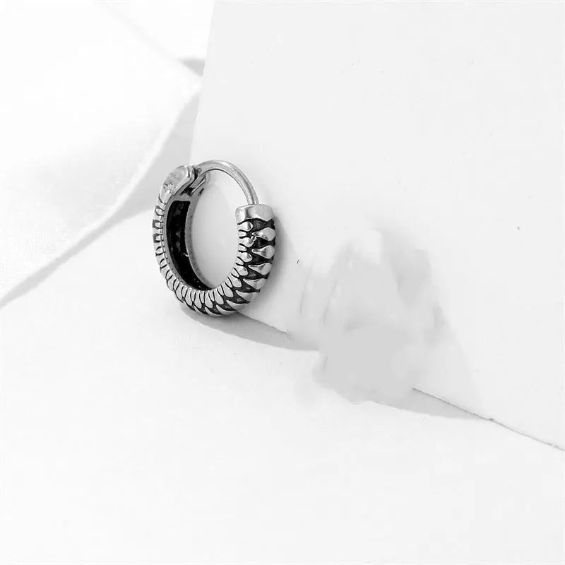 Geometric silver retro twist earrings with stripe detailing on circular titanium steel hoop