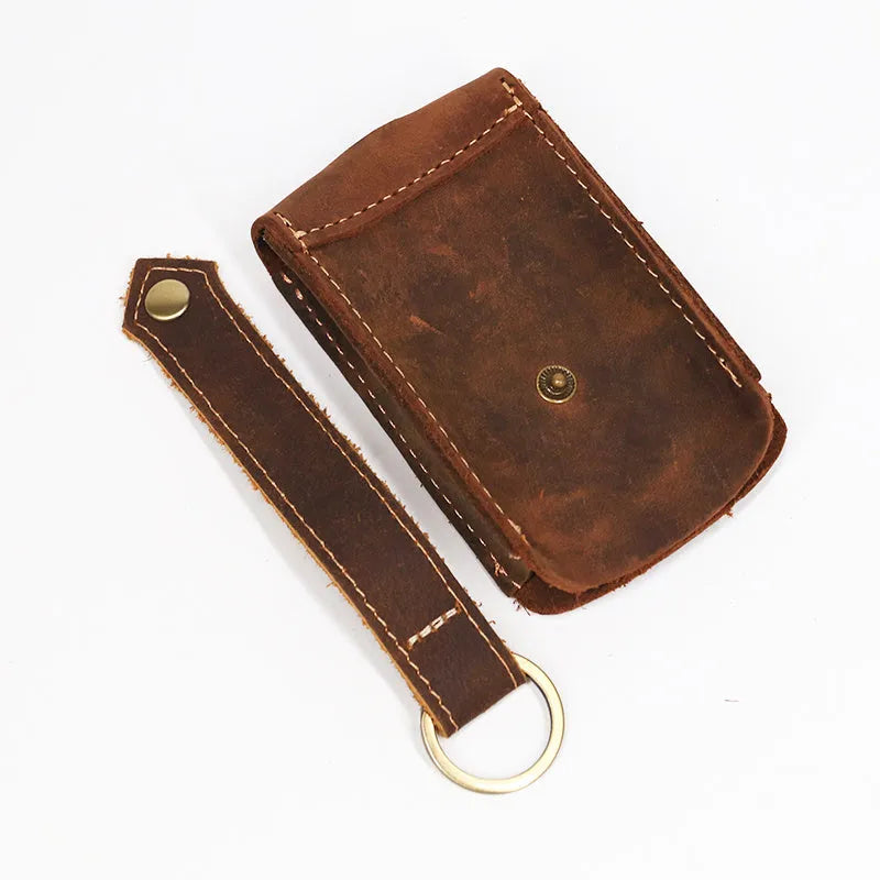 Crazy horse leather key case in dark brown, 7cm by 11.5cm, resting on a surface