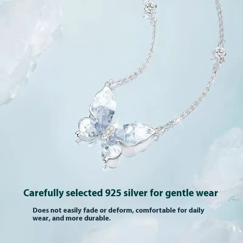 Silver butterfly necklace with adjustable chain showing pendant detail and O-ring links