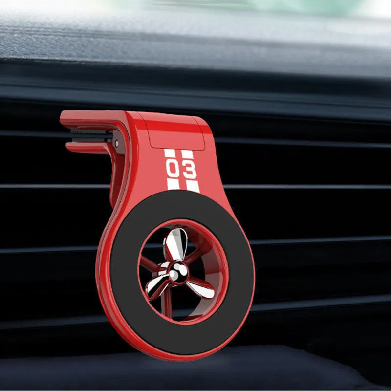 Black magnetic car phone holder attached to vehicle air vent with smartphone mounted